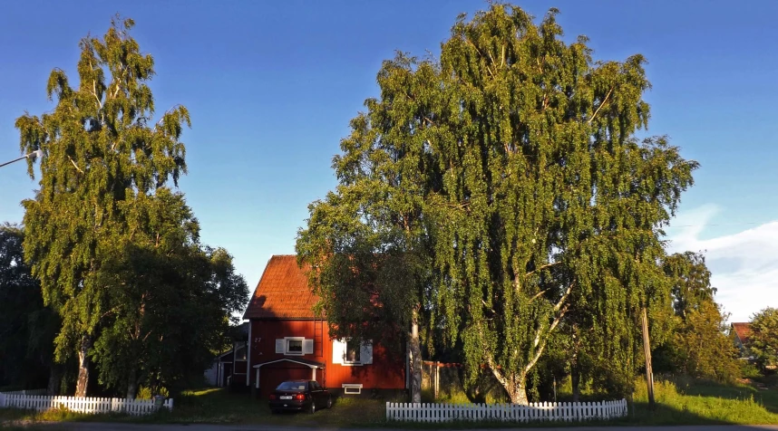 a small house on the corner of a street