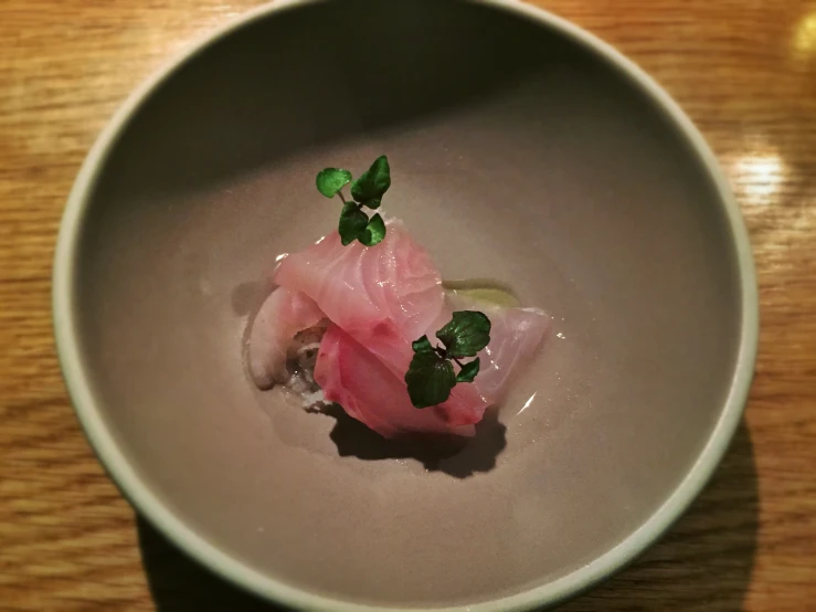 a bowl that has a small amount of food in it