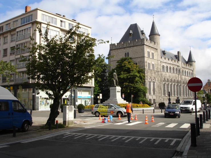 there are many cars parked in the city street