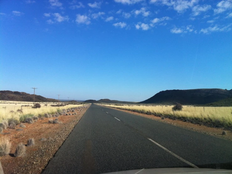 a car window view of an empty road