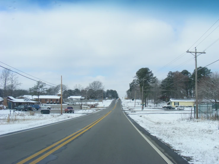 the road has snow on it during winter