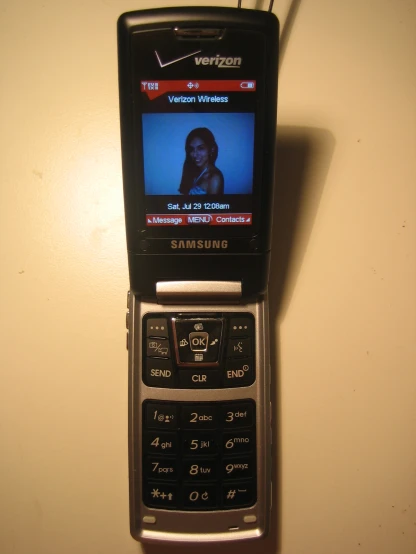 a cell phone that is hanging from a wall