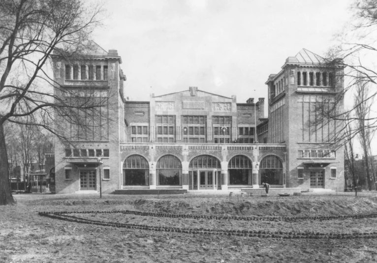 old historic pograph showing a large building with many windows and balconies