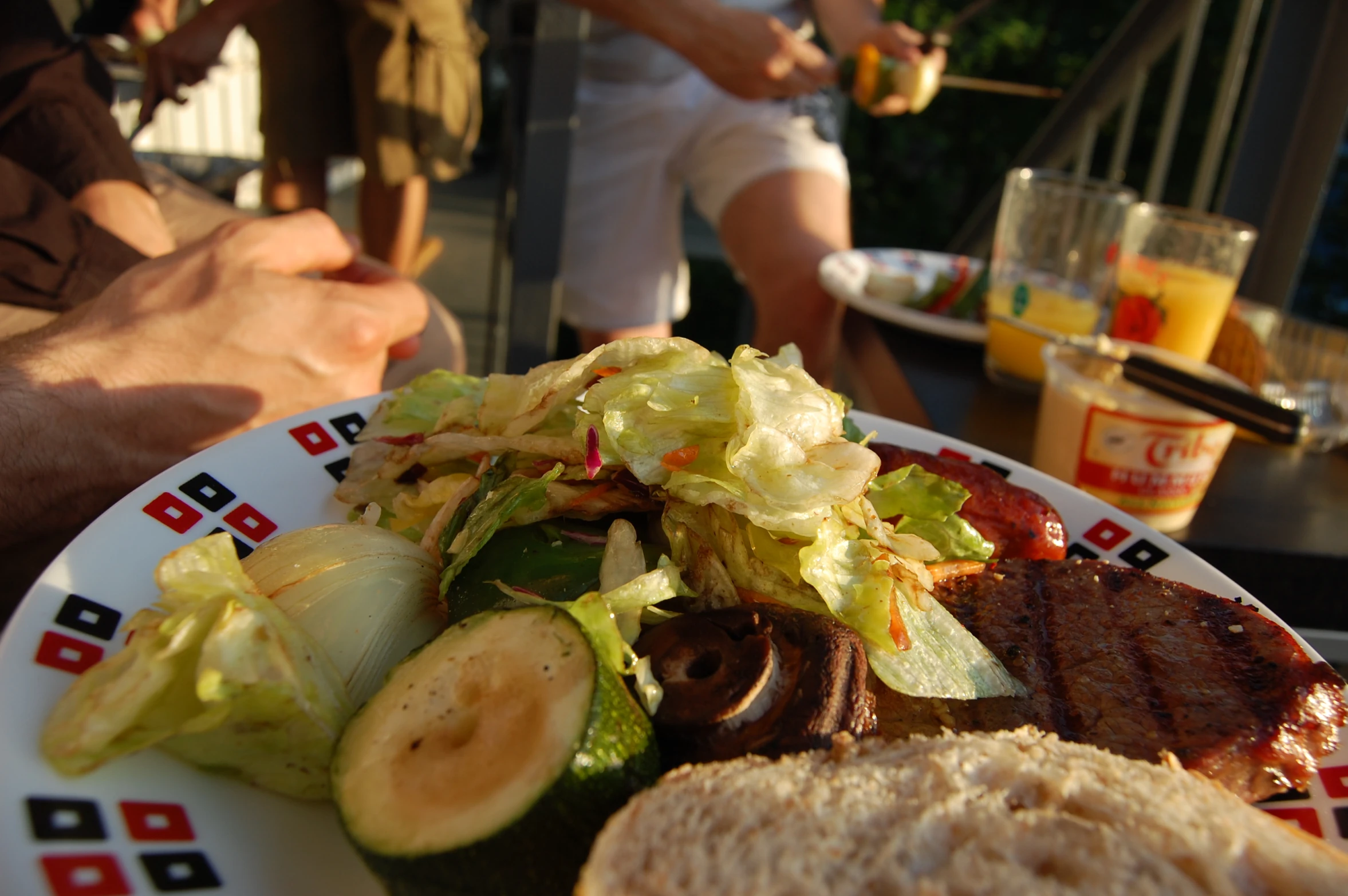 a plate of food including meat, lettuce and potatoes