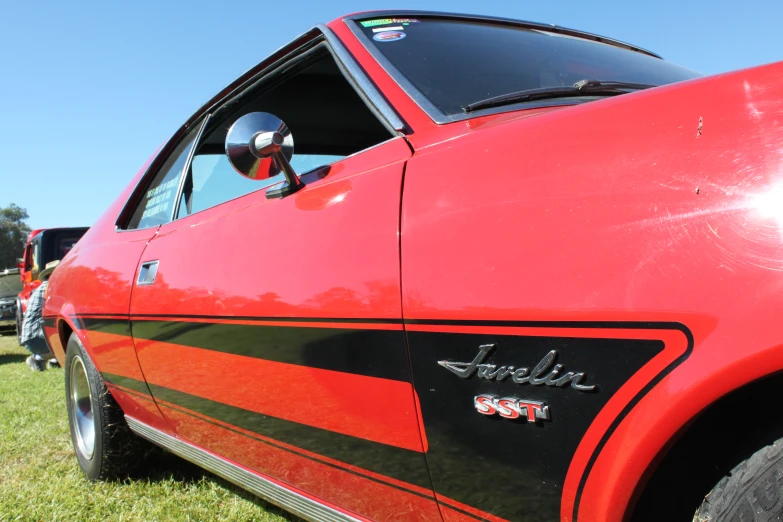 a car with its door open in the grass