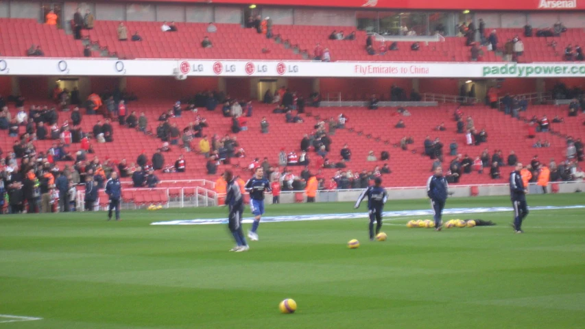 a soccer game in progress with some players on the field