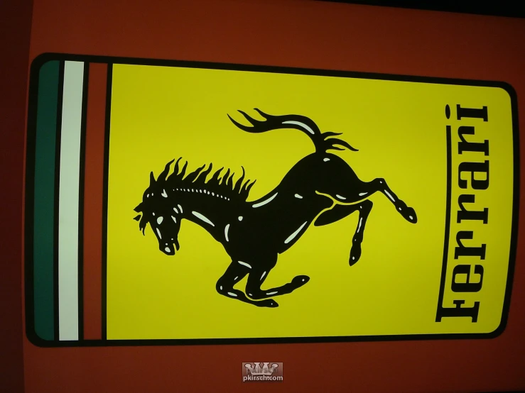 a yellow and red sign with a black horse running