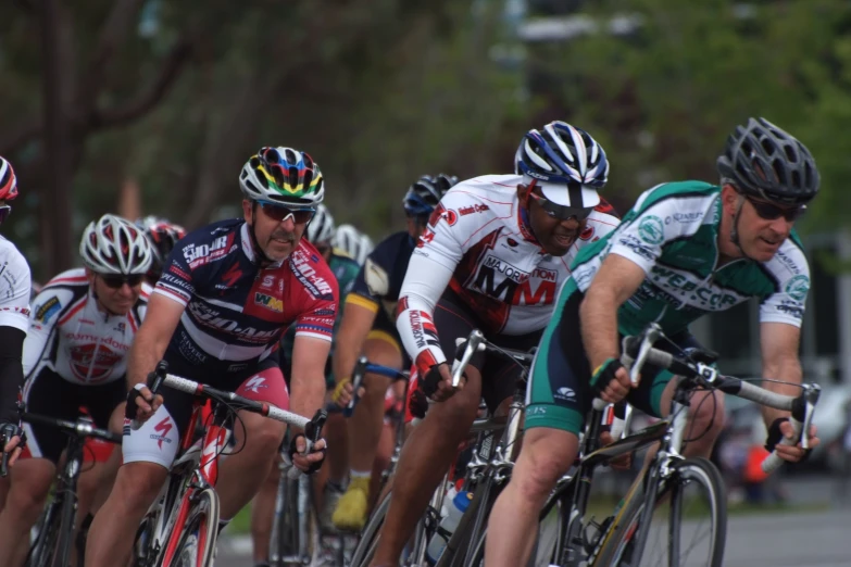 multiple bicyclists in various positions during a race