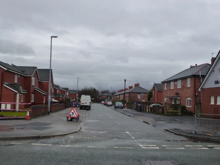 a long street in the middle of a rural area