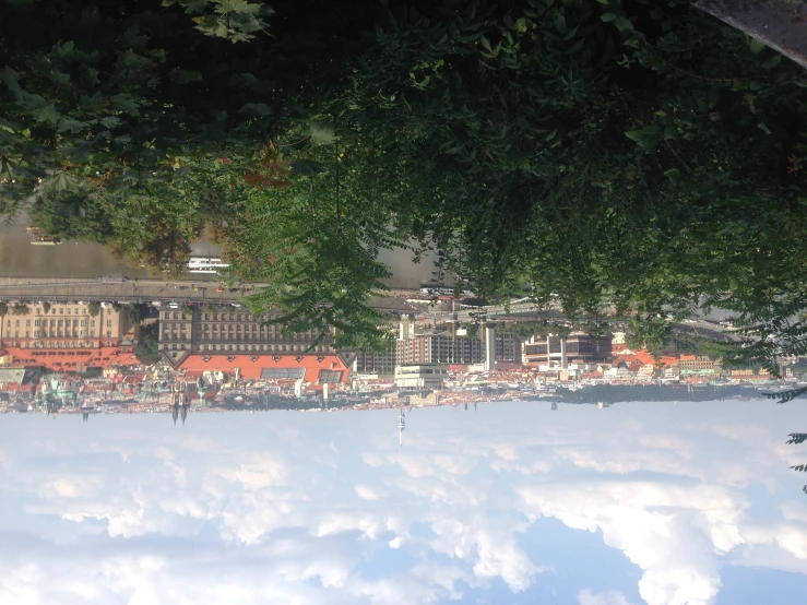 some very pretty buildings with orange roofs on a cloudy day