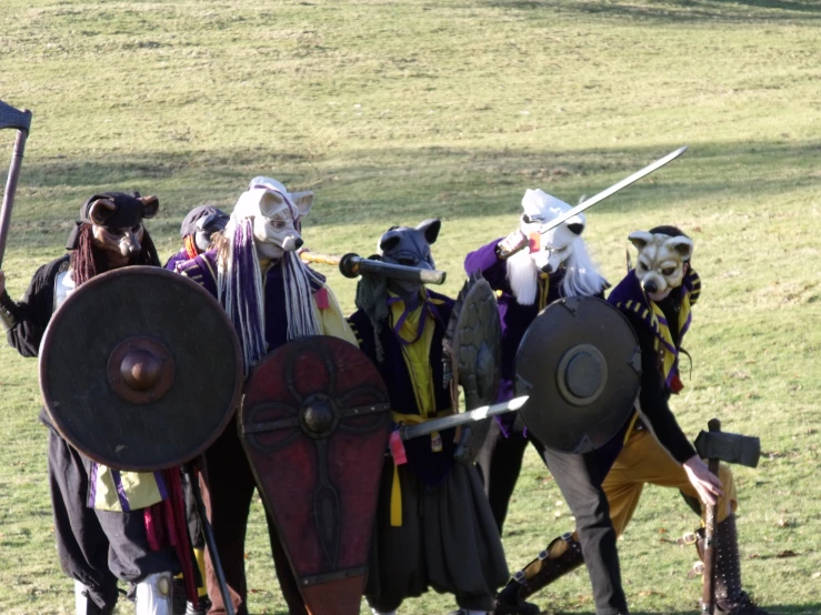 several people dressed up as knights posing for a po