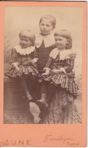 a family po with an old fashioned picture