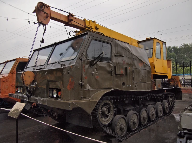 a large, army looking vehicle parked in a lot