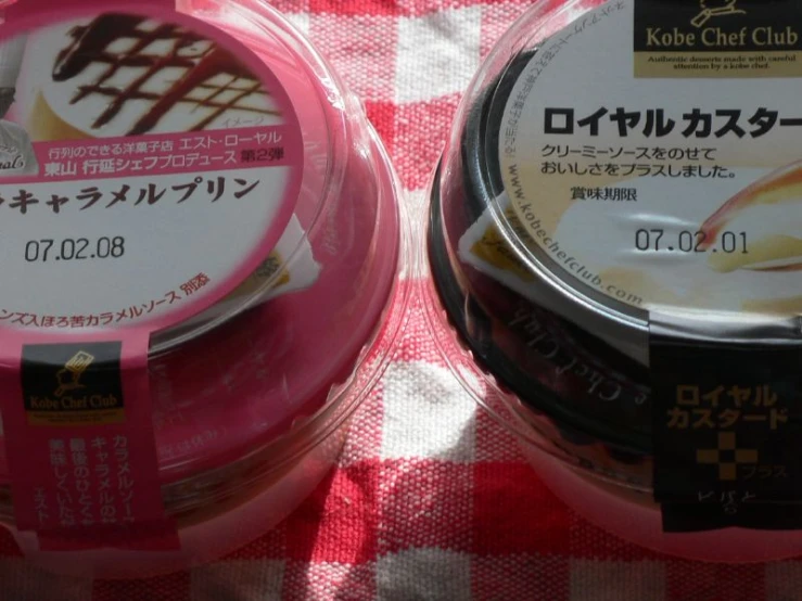 some tins with some type of chocolate topping in them