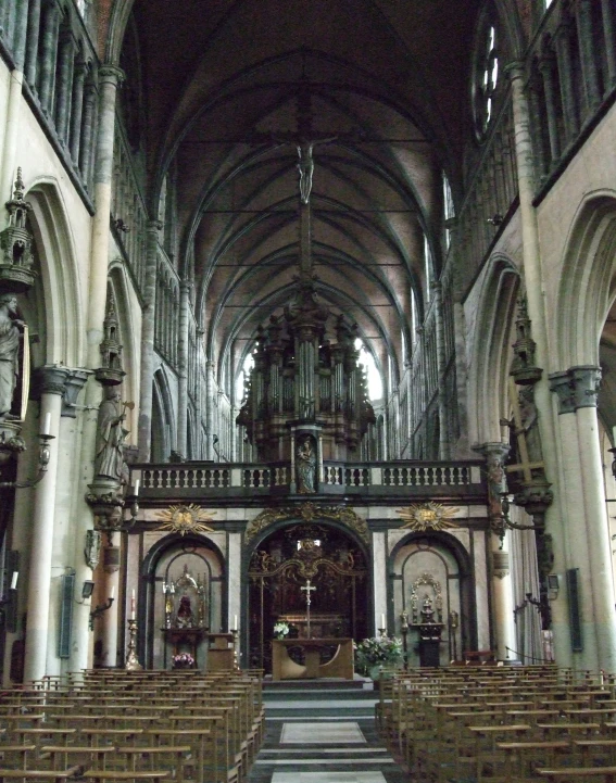 a cathedral with benches inside of it and vaulted ceilings