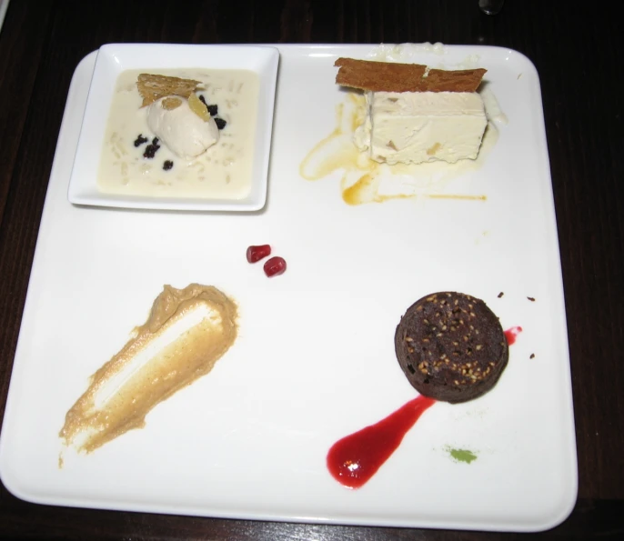 some different kinds of desserts on a white plate