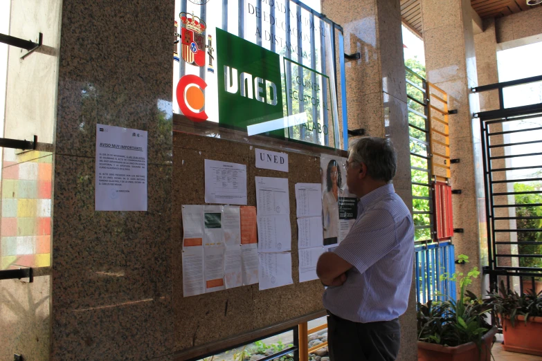 a man in front of some paper work