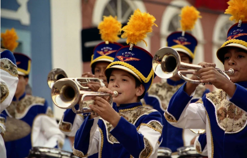 s playing instruments in front of an audience