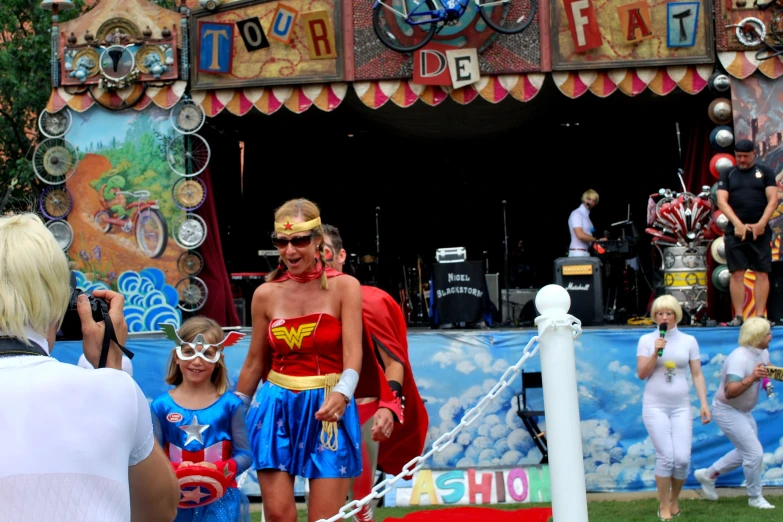 the people are in costumes to be at an outdoor music festival