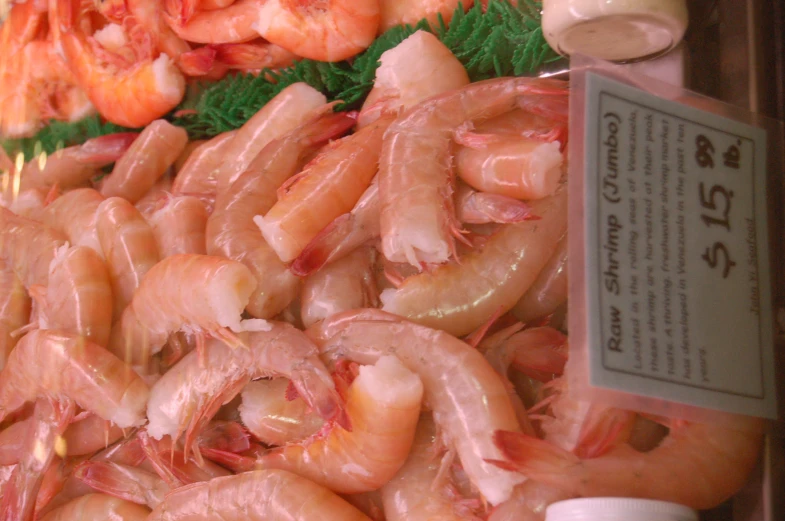 shrimp is being displayed for sale at an open market