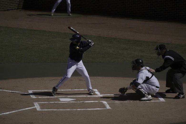 a batter, catcher and umpire during a baseball game