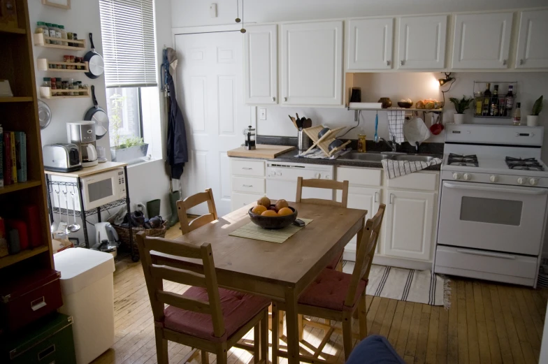 a kitchen with white walls and white appliances