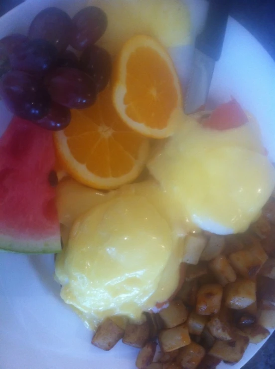 oranges, gs, nuts and watermelon are arranged in a plate