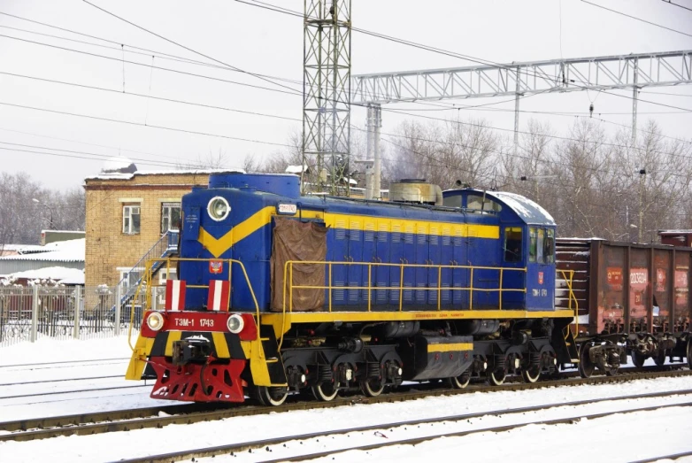 a train sits on a track in the snow