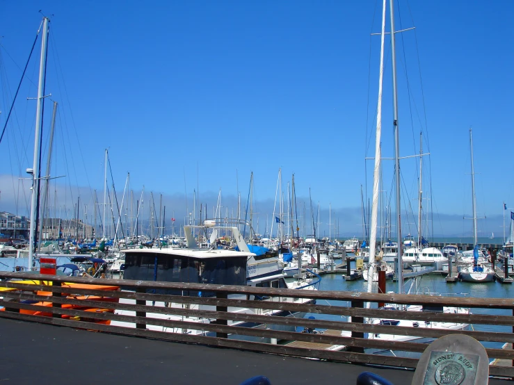 the view over a harbor with boats sailing