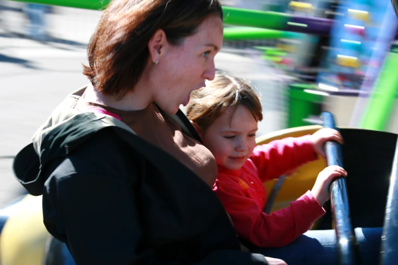 a little boy on a trolley in the sun