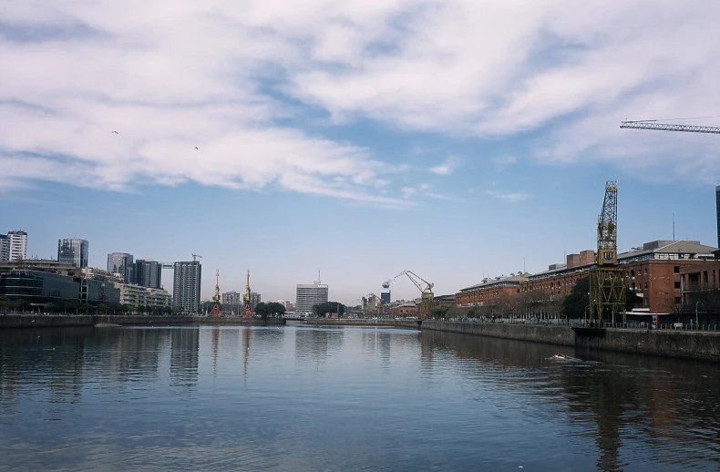 a river with a bunch of buildings near by