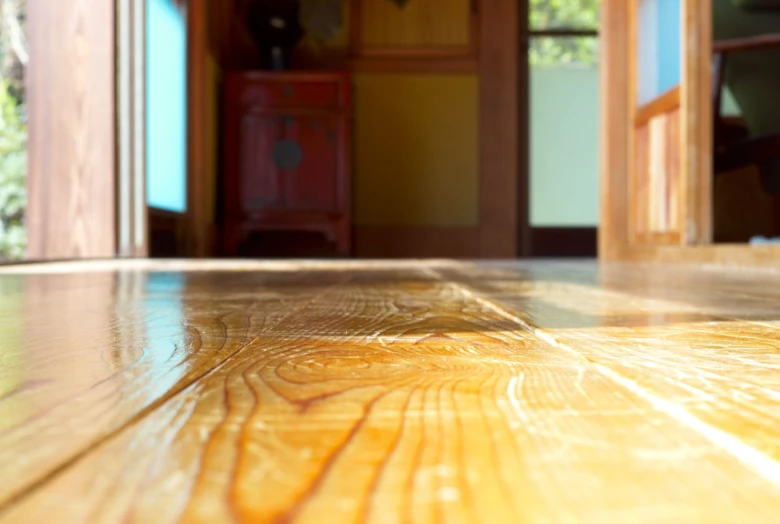 a room with wood floors and sliding glass doors