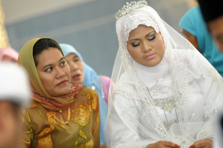 a bride reading vows to another woman