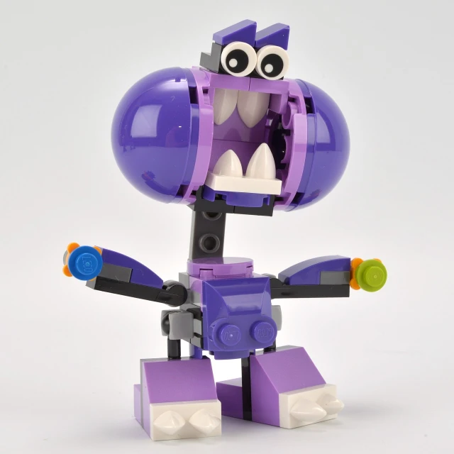an purple and orange robot with a big smile