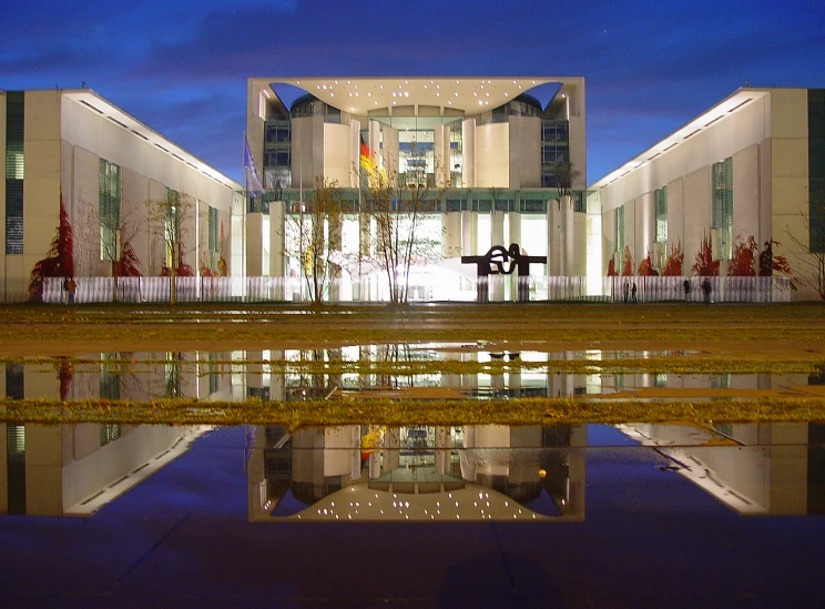 an art deco building lit up at night