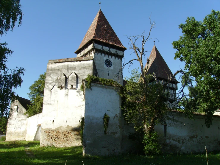 the large clock is built into the small tower