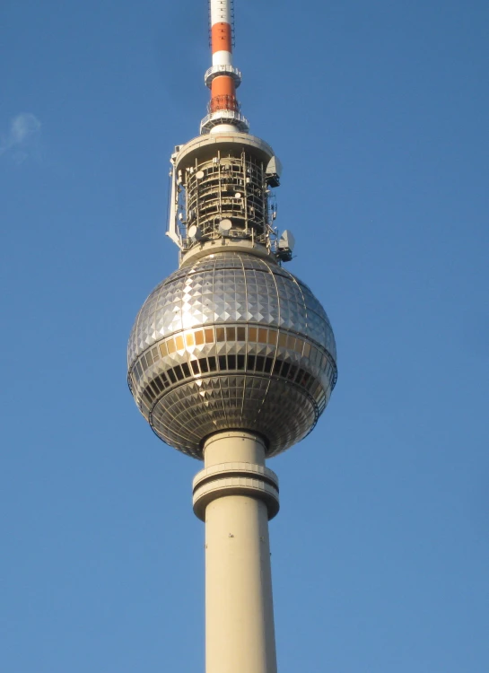 the tower is made of glass and has a metal top