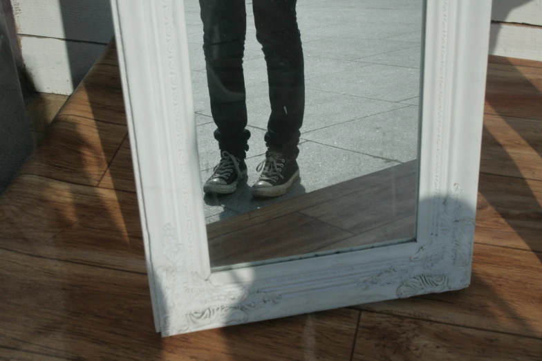 the reflection of a person in a mirror