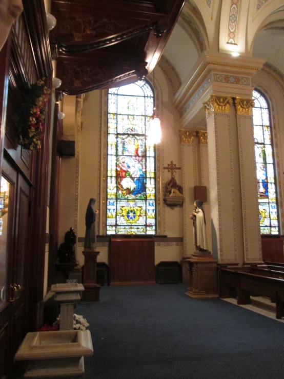 the inside of an old church that features stained glass