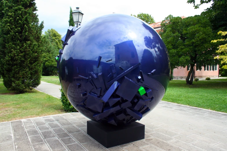 a large metal ball on a small stand