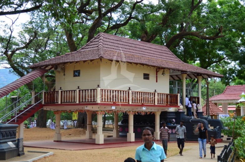 a woman standing in front of a house