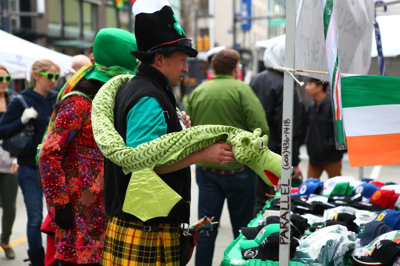 a group of people stand at a farmers market