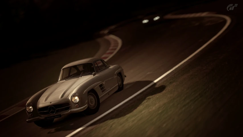 an old - fashioned convertible car driving on the road at night