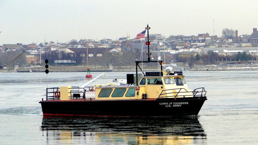 there is a tug boat moving on the river