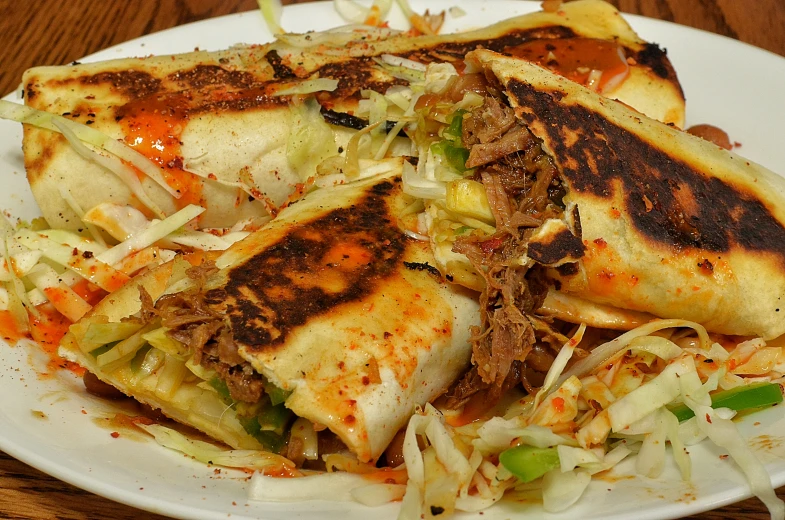 food is piled on top of each other on a plate