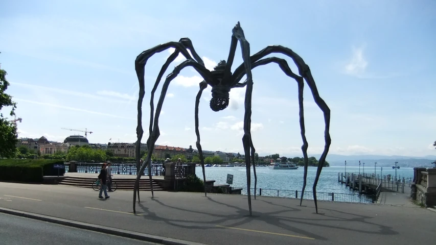 there is a giant metal spider in the middle of the road