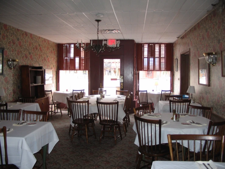 there is plenty of chairs and tables in the dining room