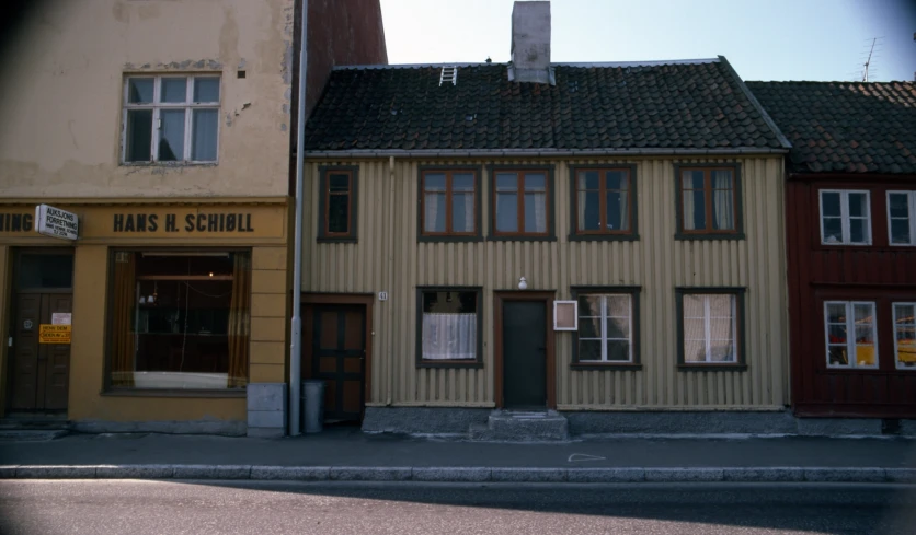 the corner of a street next to two buildings