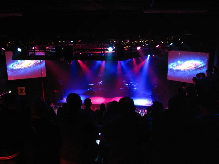 a theatre with bright purple and purple lights and blue lights