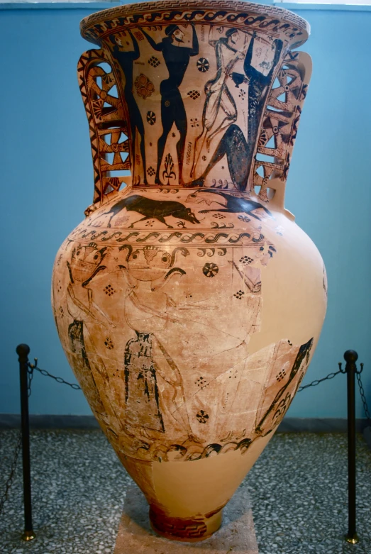 an old vase that has some people on it